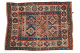 Antique Caucasian geometric rug with sapphire blue, cherry red, ivory Moghan medallions and floral border.
