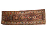 Antique Kuba runner with serrated diamond medallions, tree of life, tribal motifs in navy, madder red, ivory.