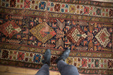 Antique Kuba runner, geometric serrated medallions, finned leaves, and rich colors with historic patina.