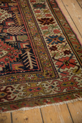 Antique Caucasian Kuba runner: hand-knotted geometric patterns, finned leaves, madder red, and navy.