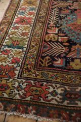 Antique Caucasian Kuba runner detail: geometric borders, madder red, ivory, navy, and fringe.