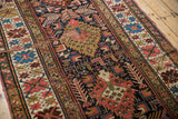Antique Kuba runner detail, geometric pattern, navy, madder red, ivory with varied pile.