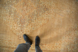 Distressed vintage Tabriz rug with faded Herati motifs, revealing worn pile and soft tones.