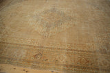 Distressed Indian Tabriz rug border featuring turtle Samovar motif, warm beige and copper.
