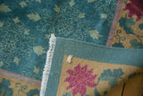 Vintage Nichols Art Deco carpet's hand-knotted foundation and fringe, showing teal, gold, magenta florals.