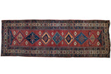 Vintage Northwest Persian runner rug with diamond medallions, crab-style borders, in cochineal red and navy.
