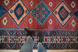 Vintage Northwest Persian runner's crab style border and red, navy diamond medallions.