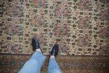 Antique Kerman runner's intricate golferang rose field, ivory, blush, powder blue, and patterned border.