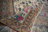 Antique Kerman runner's folded corner, revealing cochineal red golferang roses, intricate borders, and selvage.