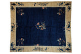 Vintage Peking carpet: cobalt blue field, central vase with blossoms, pictorial gold border.