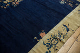 Chinese Peking carpet: dusty gold border with blue butterfly and pictorial vase motif.