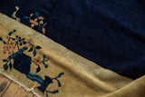 Vintage Chinese Peking rug border showcasing dusty gold pictorial vase motif and floral vinery.