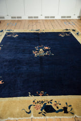 Vintage Peking carpet's dusty gold border with blue and rose floral vinery design.