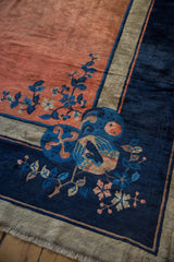 Vintage Peking carpet corner: stylized bird and floral vines in cobalt, copper, and sand.