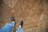 Distressed vintage Tabriz carpet in coffee brown and blush Herati motif, with even wear.