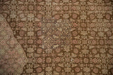 Distressed pile texture with a visible patch in coffee brown and dusty blush Herati motifs.