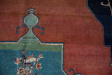Antique Tabriz carpet's madder red abrashed field, ocean green floral bouquet, Samovar spandrel.