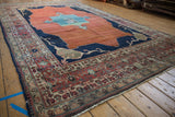 Antique Tabriz carpet border featuring madder root red, indigo blue, and cream hand-knotted patterns.