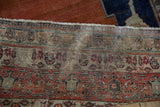 Antique Tabriz carpet's reverse side, showing foundation threads and old moth damage etching.
