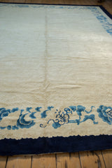 Vintage Peking rug border with indigo blue curvilinear motifs on ivory, dark blue edge.