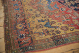 Green minor border and saffron yellow field of an antique Bijar rug, showing wear to foundation.