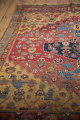 Antique Halvai Bijar rug: rare green minor border, saffron yellow, and cherry red floral motifs.