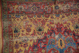 Detail of antique Halvai Bijar rug, showing rare green minor border, saffron yellow field, and worn floral designs.