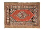 Fine Camel Hair Serab rug with a diamond medallion in brick red, navy, and camel tones.