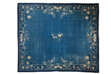 Vintage Peking carpet: cobalt blue field, central blossom vase, detailed floral vinery border, 8'3