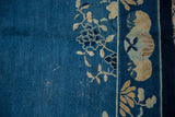 Vintage Peking carpet: time-softened cobalt blue field, ivory floral vinery, eucalyptus border.