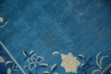Ivory and blue floral vinery on a vintage Peking carpet corner.