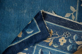 Folded vintage Peking carpet border with indigo, floral vinery, eucalyptus, and blue field.