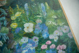Detail of Charlie's Flowers painting, showing vibrant blue, pink, white, and yellow blossoms.