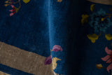 Sapphire blue vintage Art Deco rug with blush blossoms and oxidized silver band.