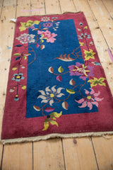 Burgundy border and light fringe of the vintage Nichols Art Deco rug runner.