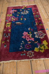 Nichols Art Deco runner corner with intact fringe, burgundy border, indigo florals.