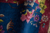 Nichols Art Deco rug pile texture with indigo, raspberry, and lime green oversize flowers.