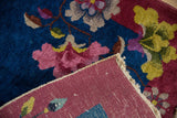 Woven reverse and colorful floral pile of a hand knotted Nichols Art Deco rug.