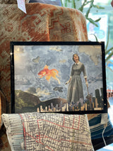 Walk Down Memory Lane mixed media art; vintage woman, orange goldfish, cloudy city scene.