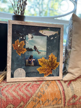 Adirondacks Mixed Media Art with photos, fish, autumn leaves, dark background, distressed frame.