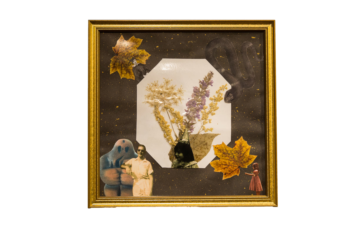 The Wildflower & The Golem mixed media art in a gold frame, with a collage of dried flowers and vintage photos.