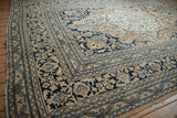 Vintage Doroksh carpet showing a traditional navy and beige scrolling floral border.