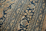 Softened pile and navy, gold meandering vines on vintage Doroksh carpet.