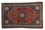 Fine vintage Abadeh rug with a stepped hexagonal medallion in rich red and navy blue.