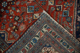 Fine hand-knotted foundation and red pile of a vintage Persian Abadeh rug corner.