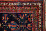 Detailed corner of a late 19th-century Afshar rug, showing its intricate geometric borders and time-softened pile.