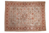 Vintage distressed Meshed carpet with an allover floral pattern in copper, olive, and pink on an ivory field.
