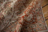 Detail of the distressed, low pile on a vintage Meshed carpet with intricate copper and brown vinery.