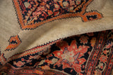 The fine, low pile texture and stepped border of a hand-knotted antique Malayer rug.