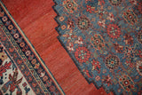 Antique Bijar rug with sky blue field, cherry red palmettes, stepped contour, and abrashed red.
